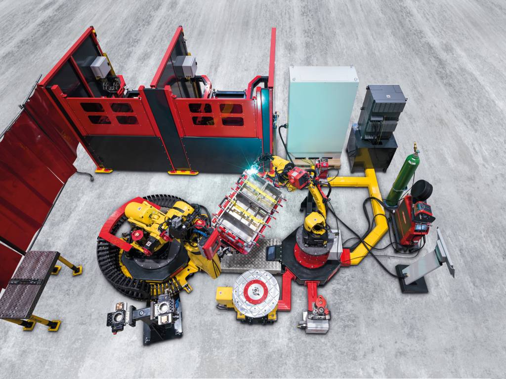 Die modularen Handling-to-Welding-Roboterzelle besteht aus folgenden Komponenten: Schweißroboter, Handling-Roboter, Robotersteuerung, Systemsteuerung, Schutzeinhausung und Bauteilschleusen.